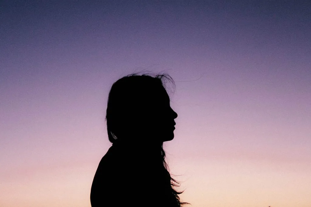 Silhouette of woman dealing with abuse